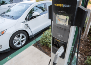 Electric car being charged at a public charge station